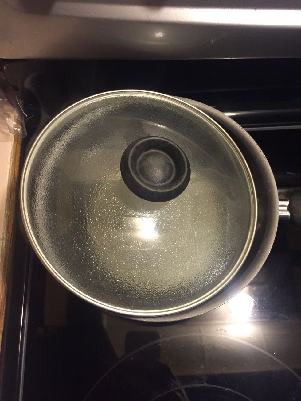 Place a lid over the pot on angle to allow the sugar/water mix to cool completely.