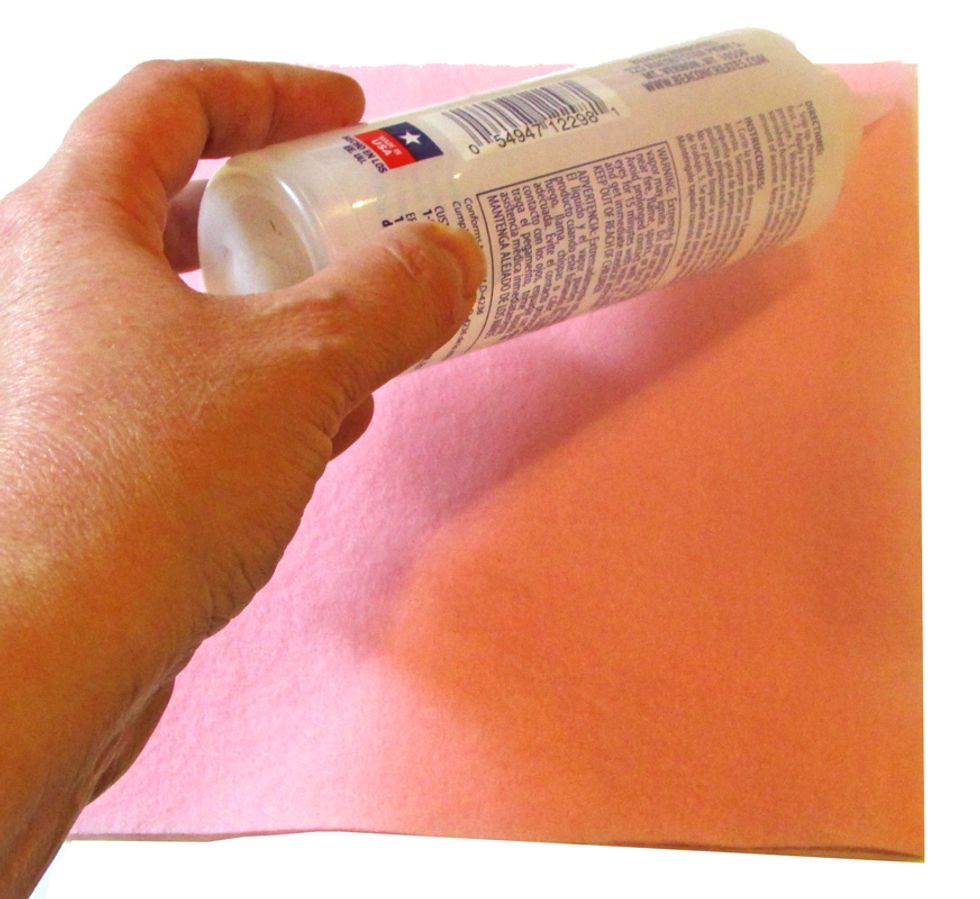Place a "line" of Fabri-tac Glue across top edge of the felt square.