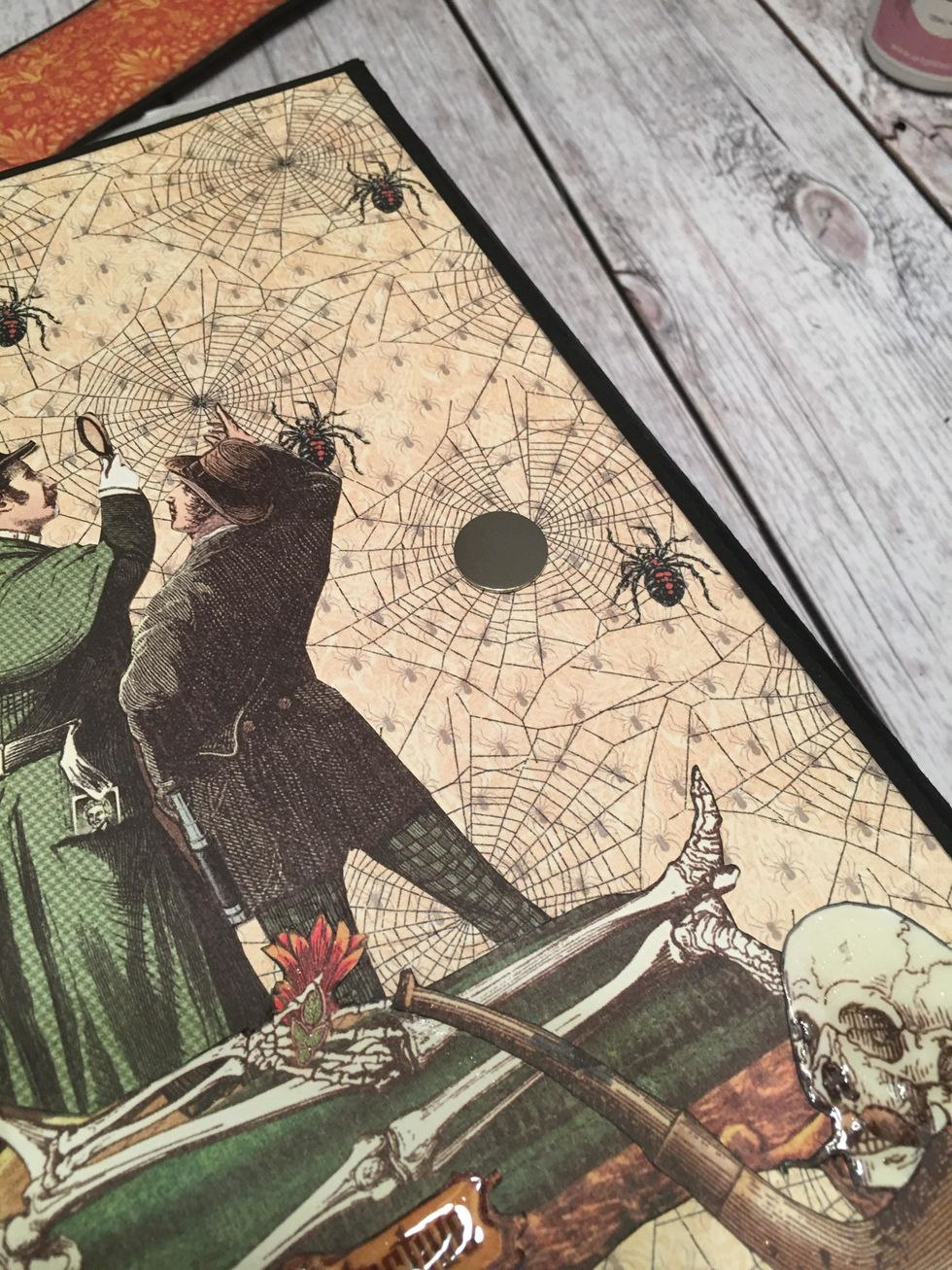 Place a magnet on the right side of the front of the album.  I show one magnet but ended up using two.