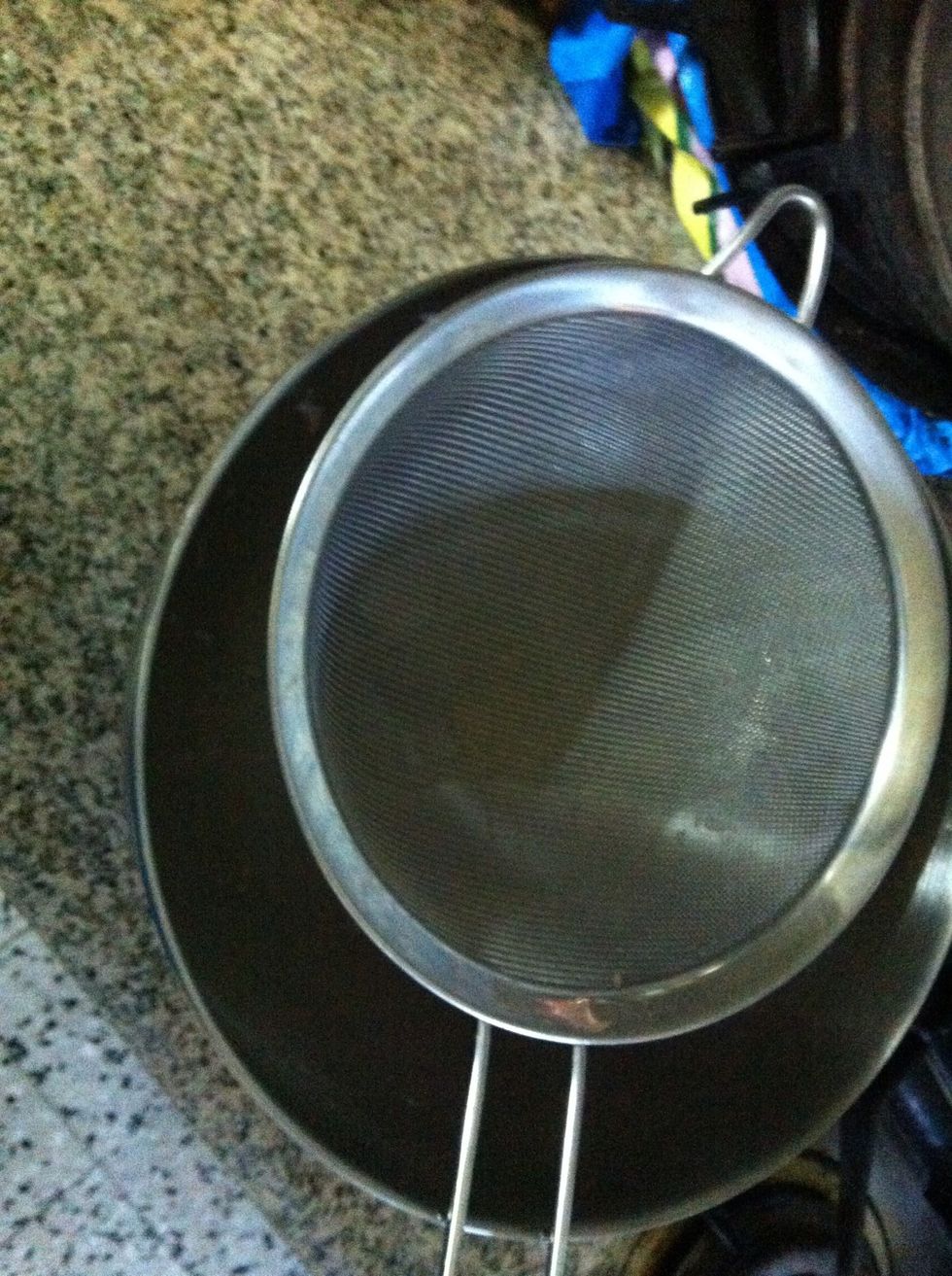 Place a mesh strainer over a bowl