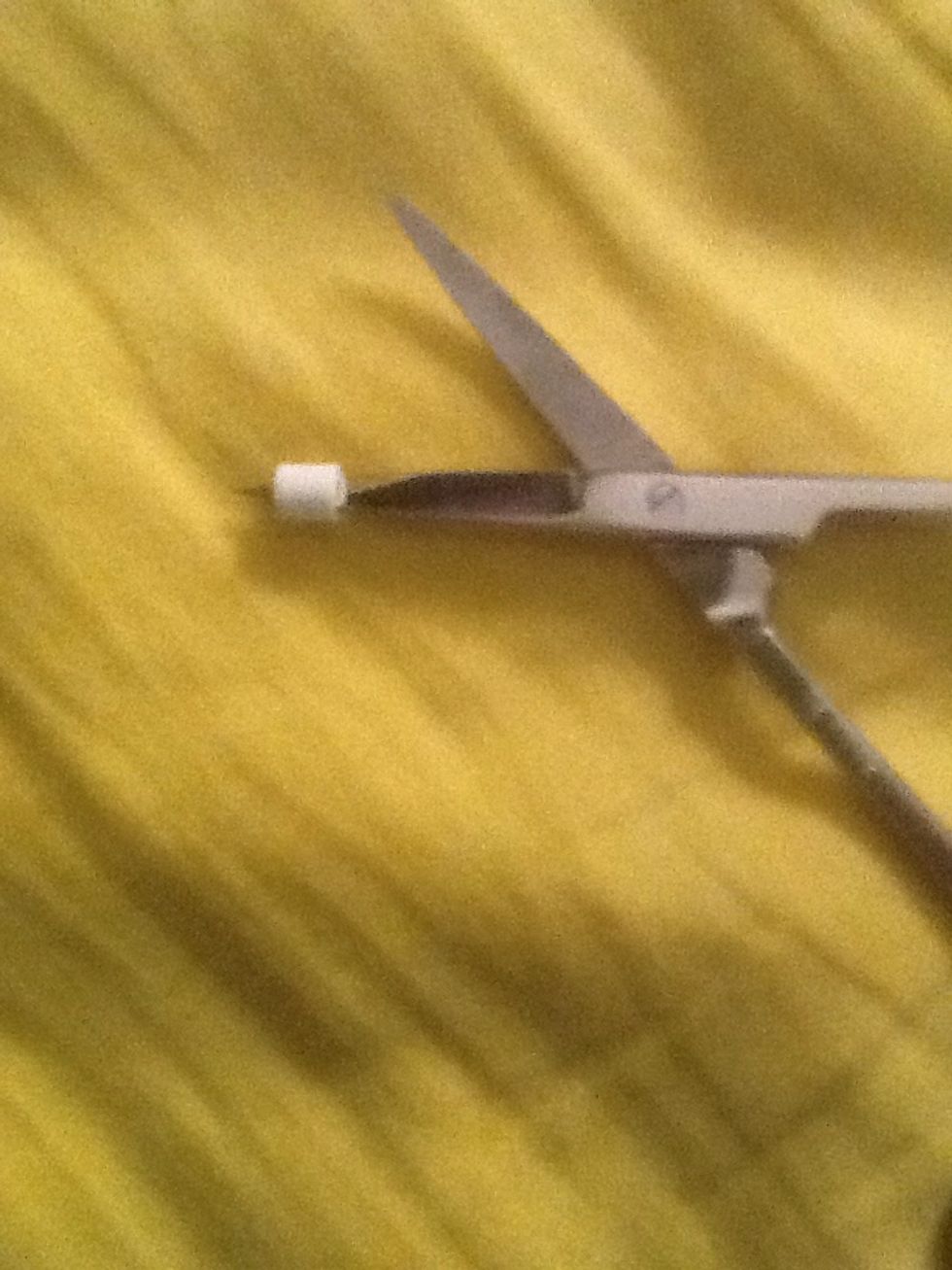 Place a perler bead on you scissors....