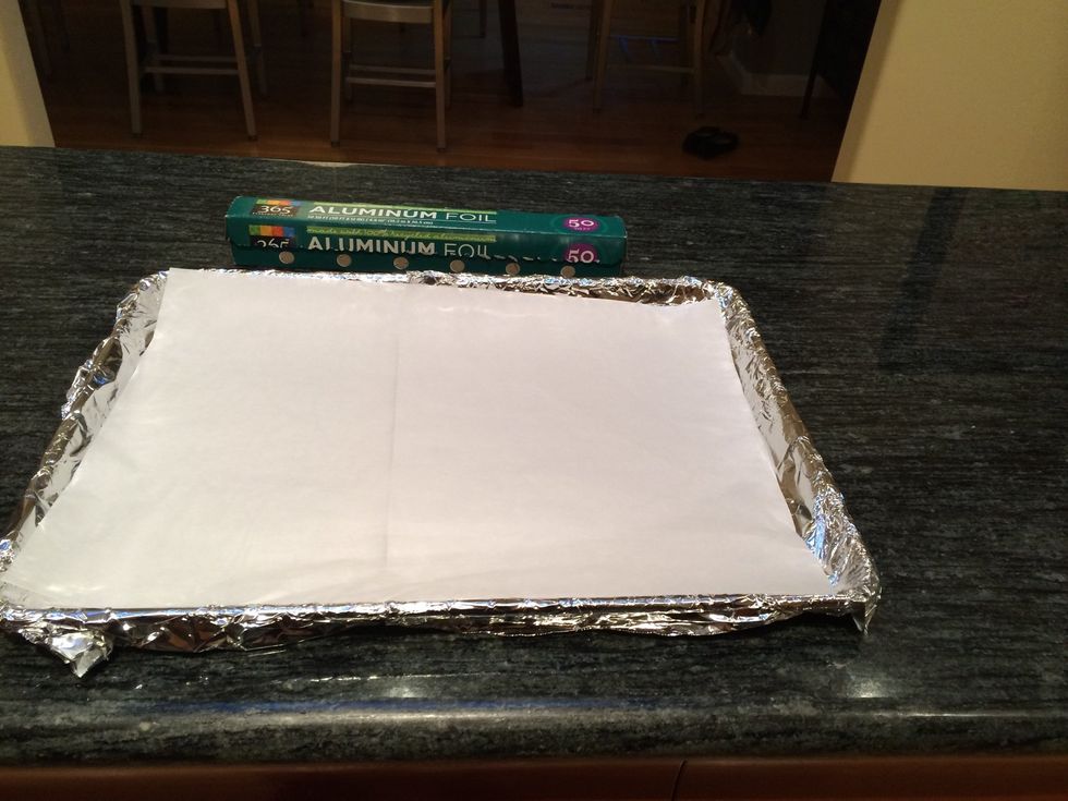 Place a piece of parchment paper over the tin foil.