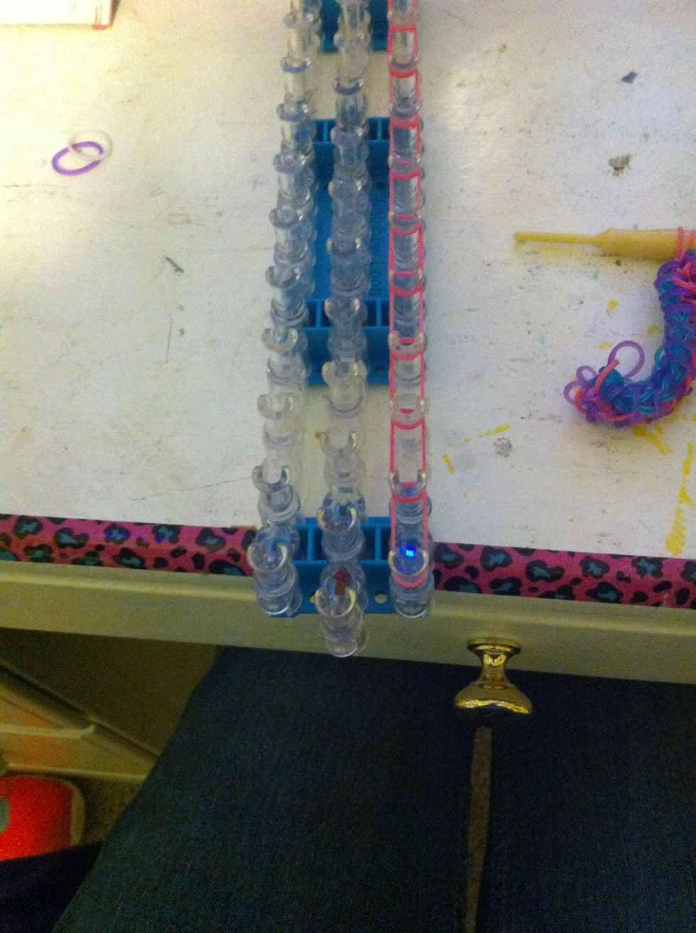 Place a row of pink bands on one side I the loom