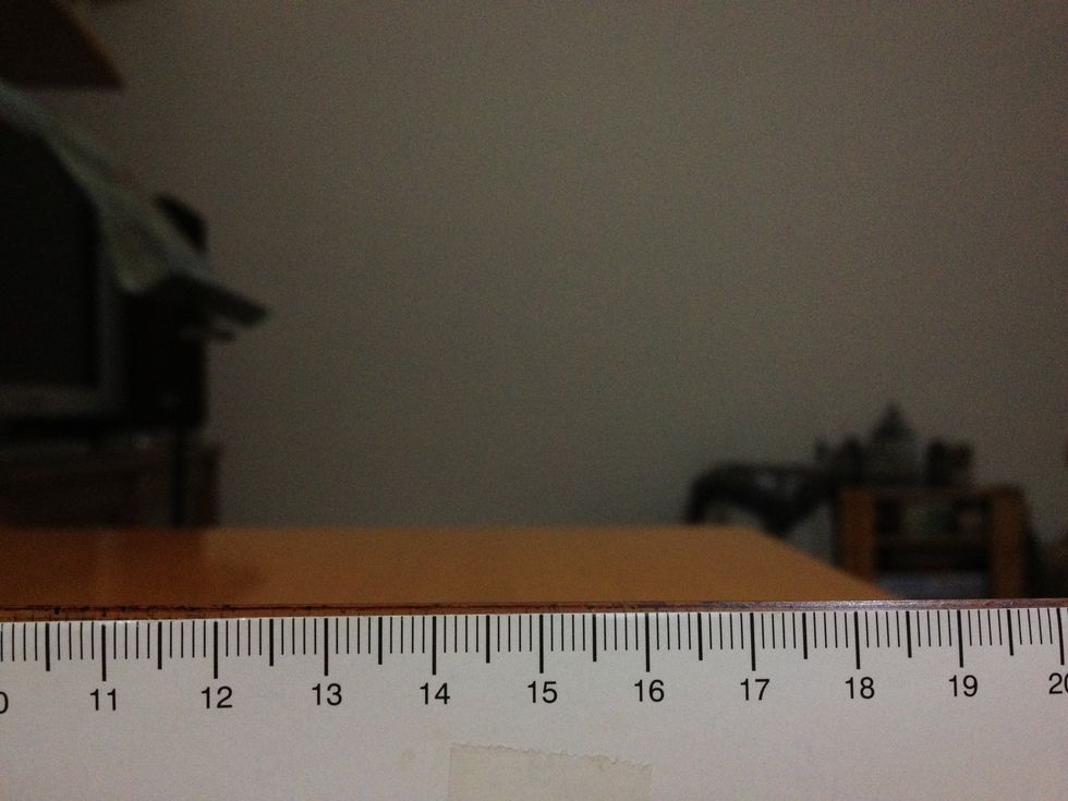 Place a ruler in front of & parallel to the phone. Phone should be in landscape. Take note of the two ends shown on screen: it's actually 10 & 20 but snapguide trimmed photos to squares