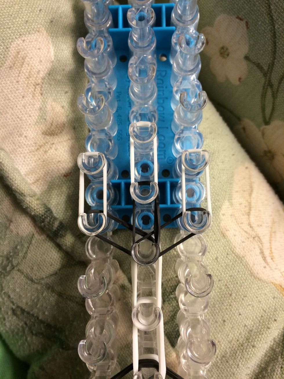 Place a set of 2 white bands on the next row. That is 6 bands total