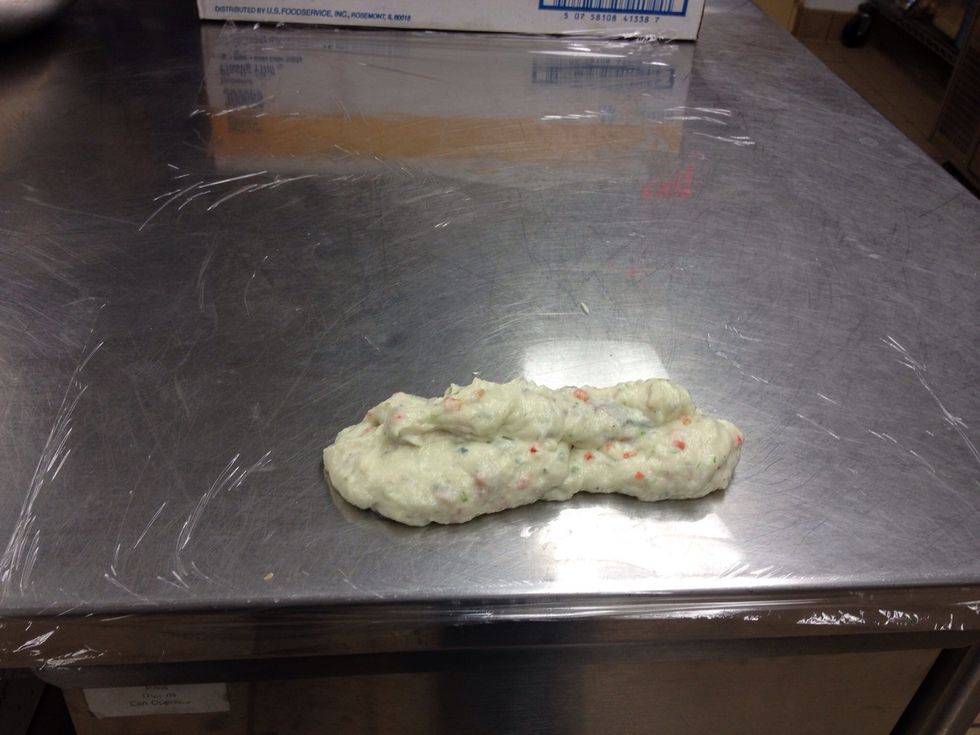 Place a sheet of plastic film on a flat surface. Place portion of mousse onto plastic.