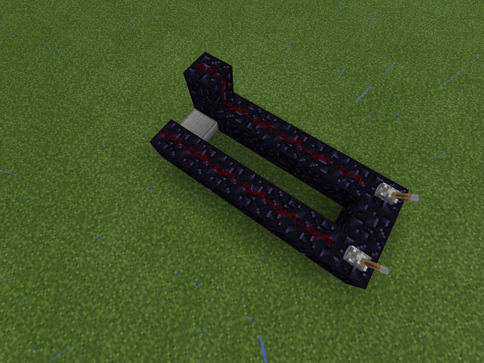 Place a slab of your choice on the ground, connecting the two columns of obsidian as shown in the photo above