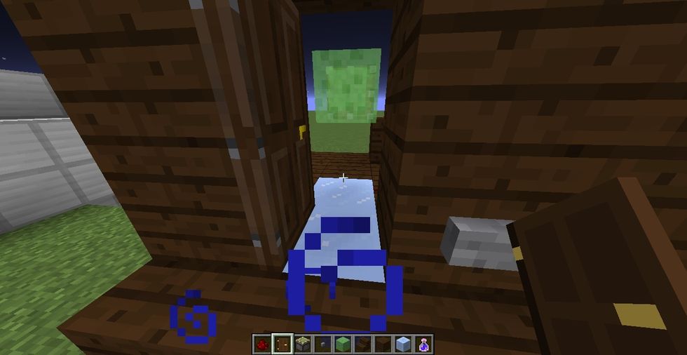 place a slime block in front of piston and place a door at front. leave it opened for now. slime block will push armor stand further. when you press button, piston should extend.