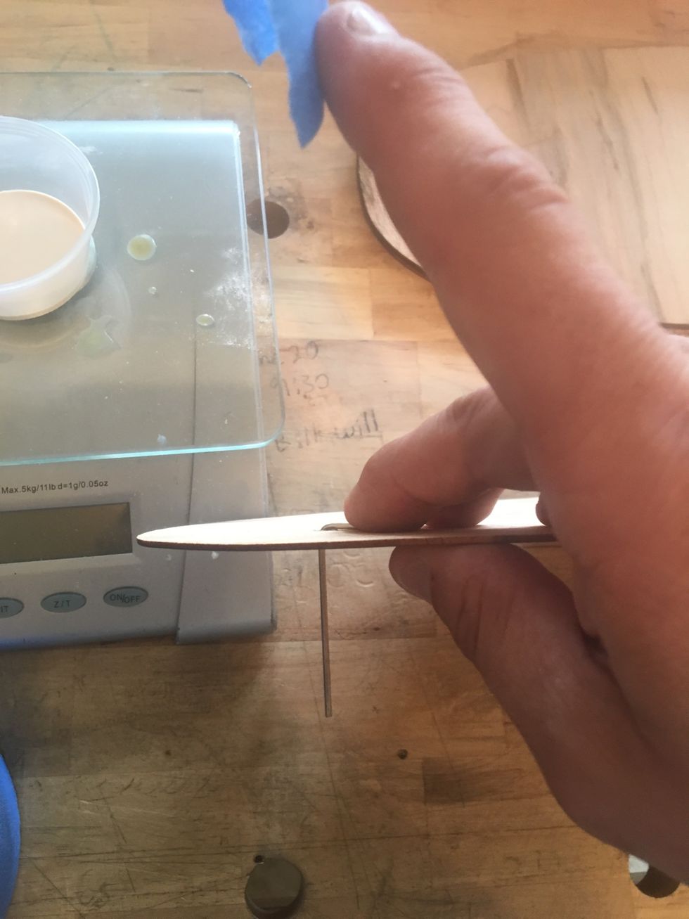 Place a small hex key through the TOP veneer. (this will be the side you stand on)