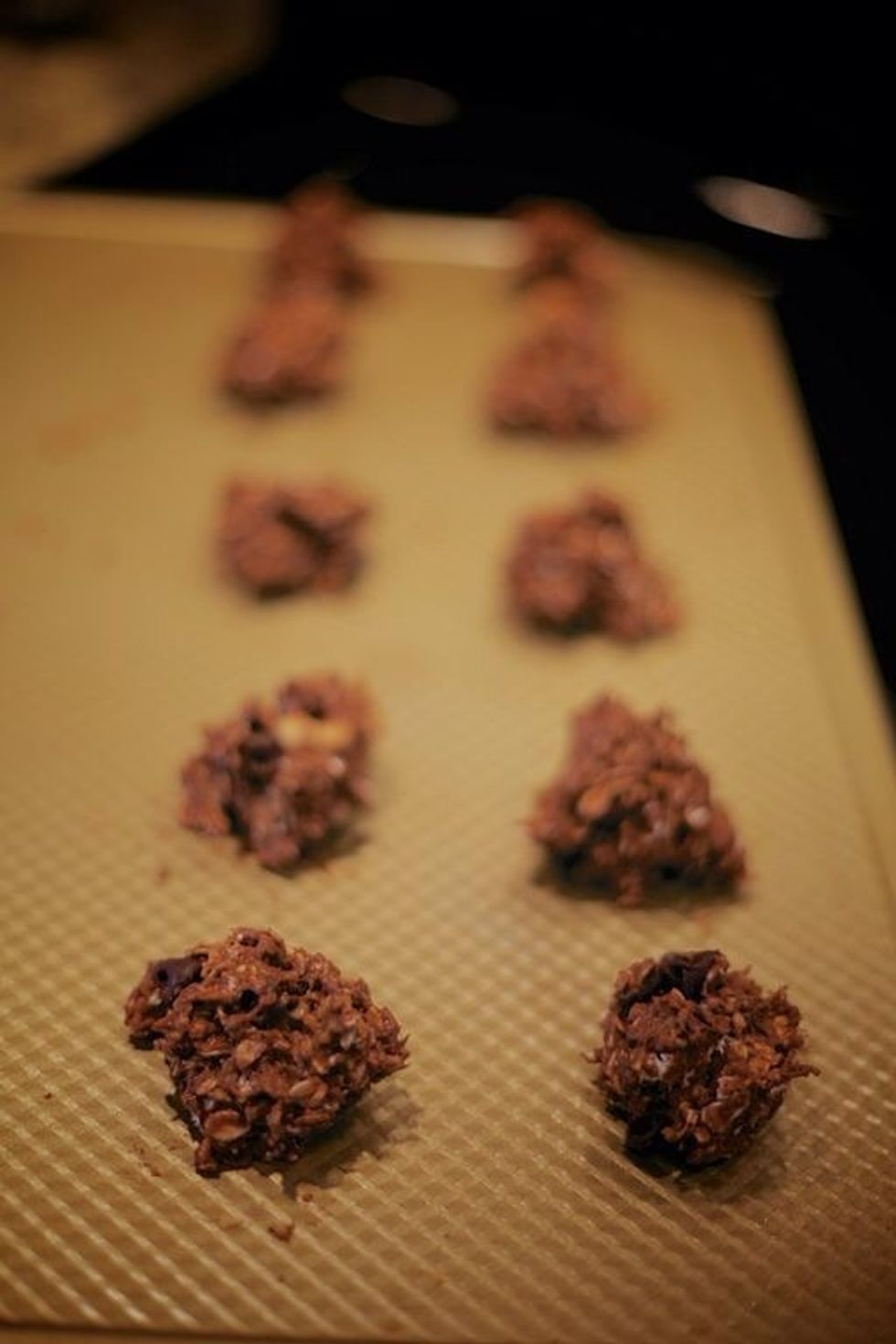 Place a spoonful of dough on cooking sheet, keeping cookies about 1/2 an inch away from each other. Bake for 10 minutes