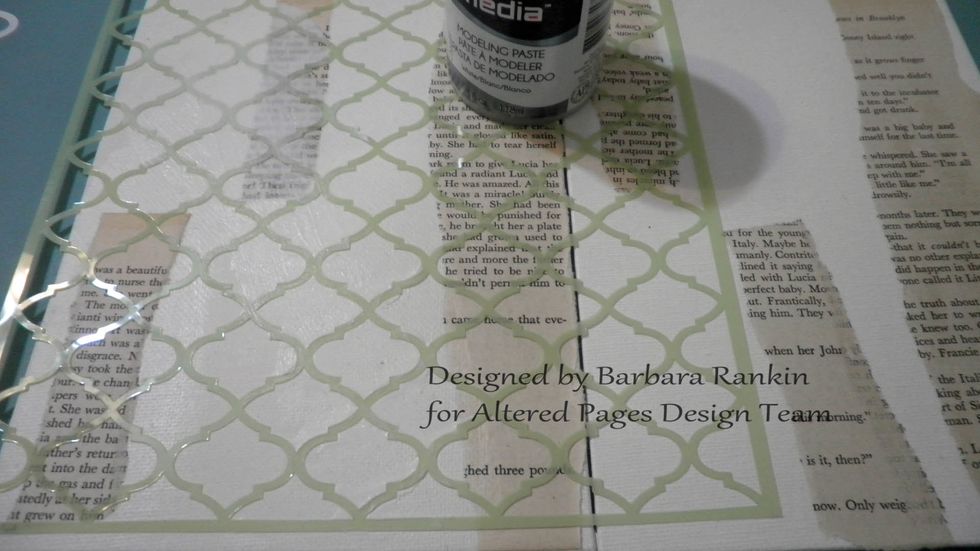 Place a stencil over the board and apply the DecoArt Modeling Paste with a spatula, leaving areas blank or partially stenciled. I also kept the center area along both boards free.