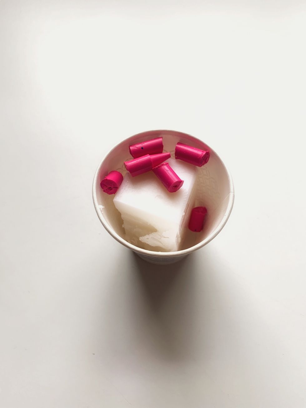 Place a stick of wax and one colored crayon into a cup, and into the microwave for about seven minutes.