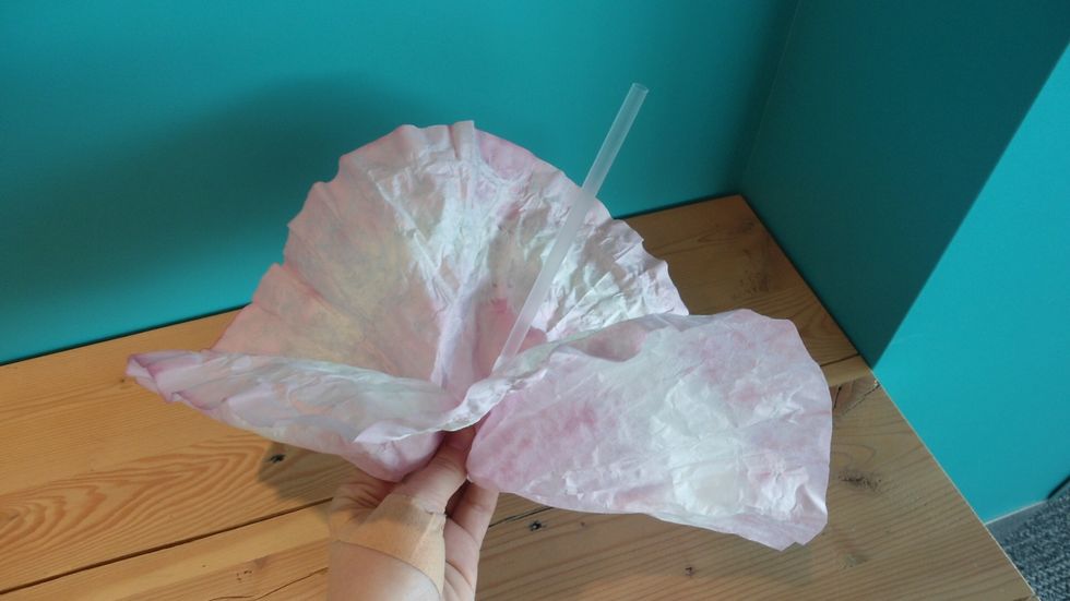 Place a straw in the middle of the filter and fold over.
