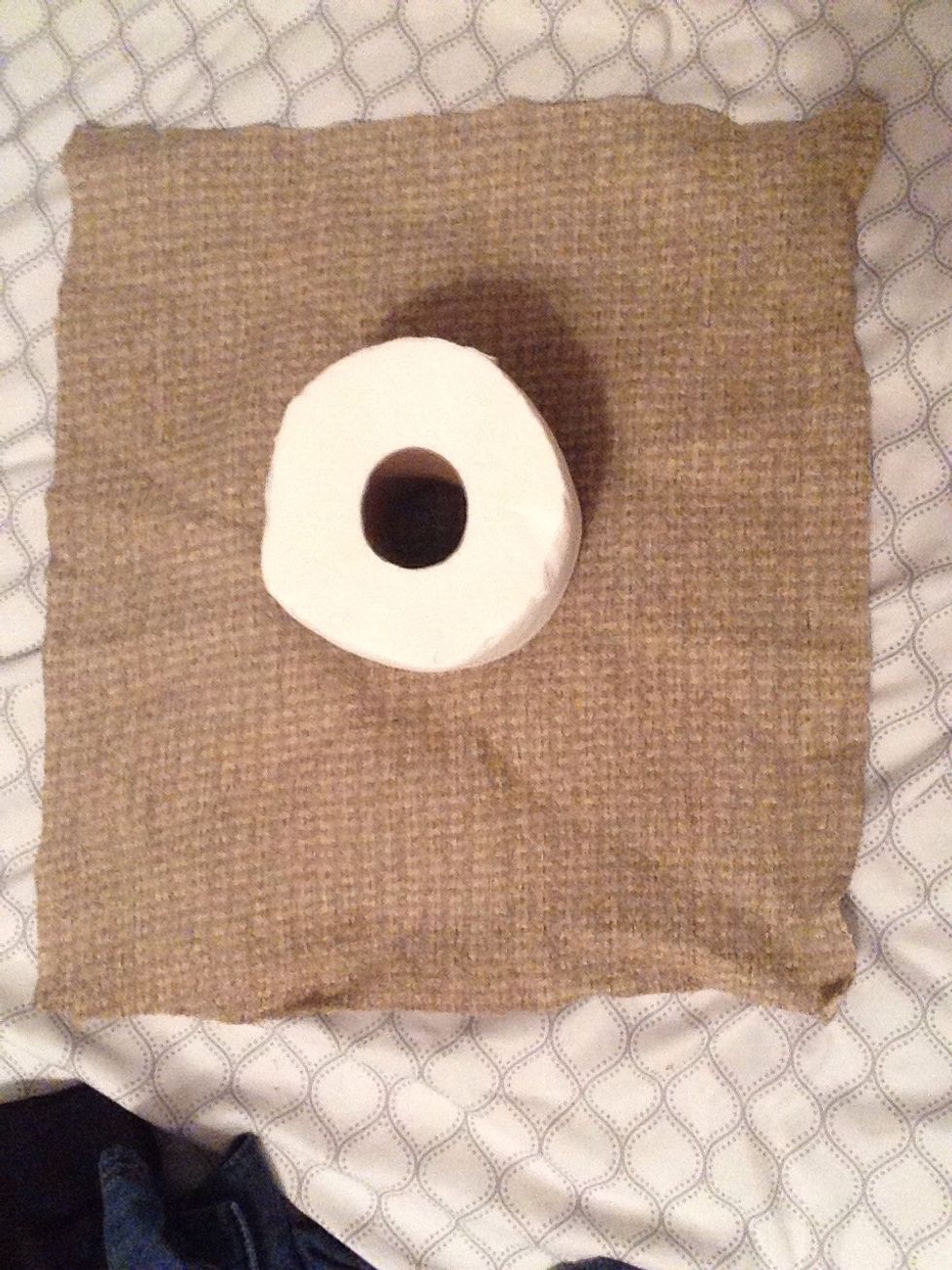 Place a toilet paper roll in the center of it.