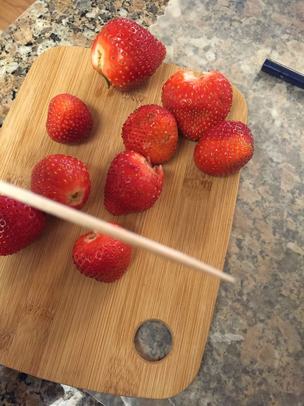 Place a toothpick at the end of strawberry for dipping