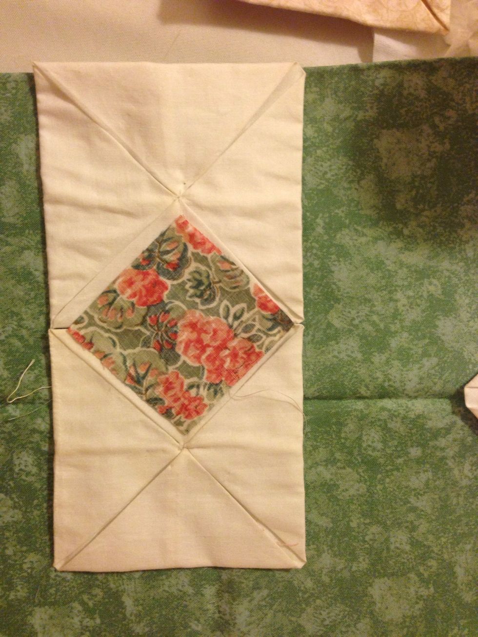 Place a two and a half square in the middle of the two larger squares. Pin down in place.