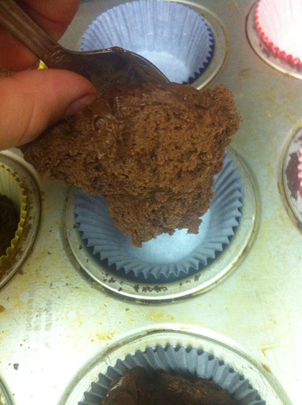 Place about 1/4 cup of batter in each liner