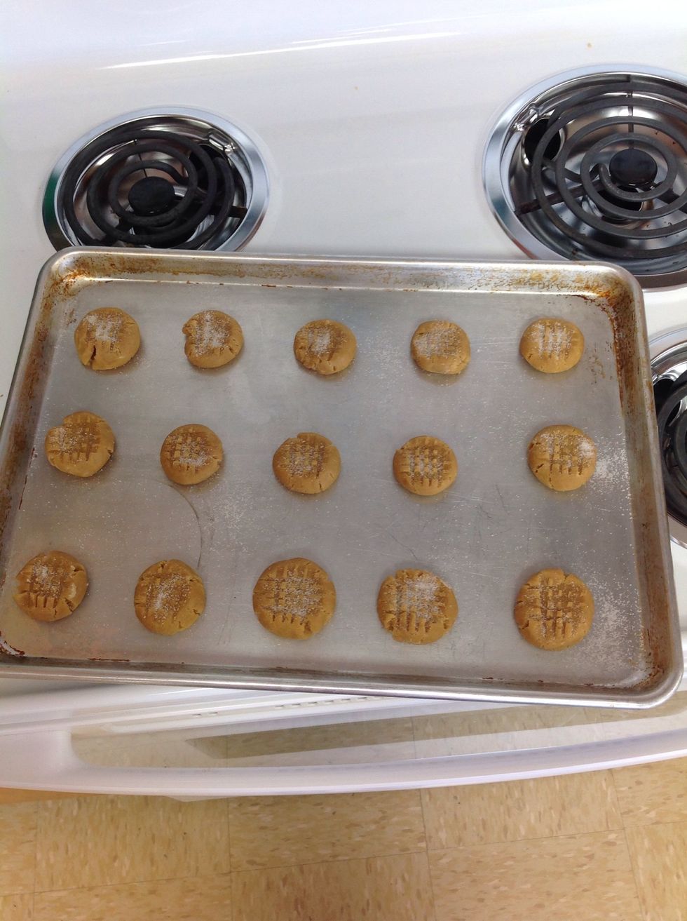 Place about 3 inches apart on ungreased cookie sheet, flatten in crisscross pattern with forked dipped into sugar