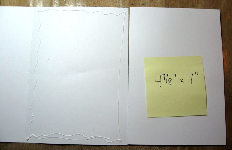 Place adhesive on the right hand side of the card on the left. Then line up the left hand side of smaller card over the adhesive so that you have about 1/8" clearance from the fold.