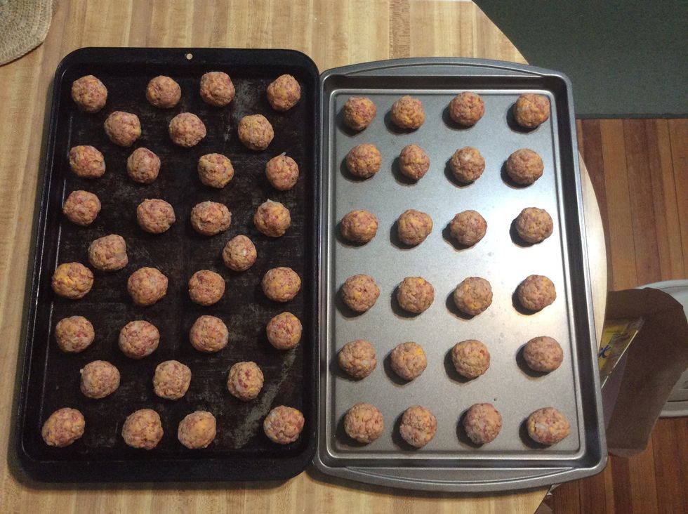 Place all of the sausage balls on the pans.