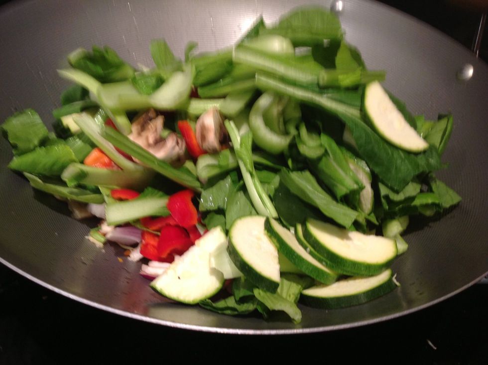 Place all of your vegetables into the pan they should start to sizzle