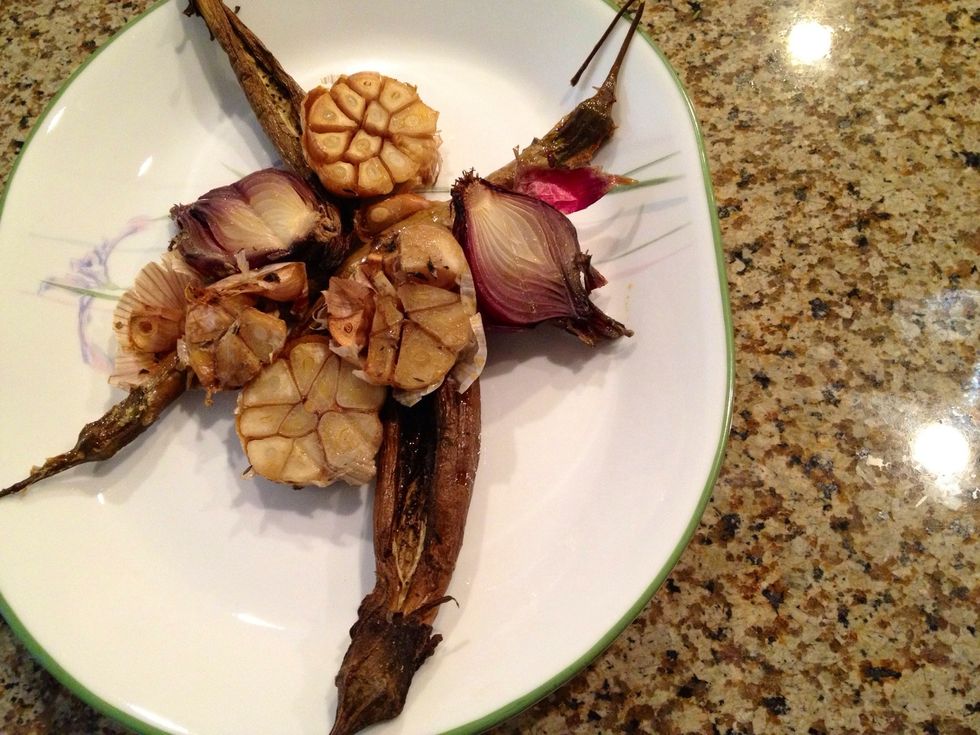 Place all roasted vegetables on the bottom of a plate.