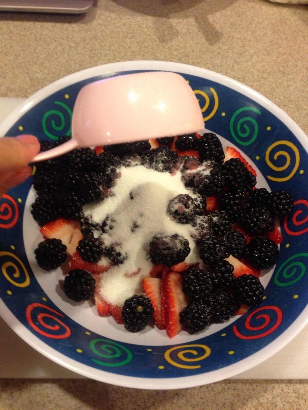 Place all the berries into a large bowl. Add the sugar...