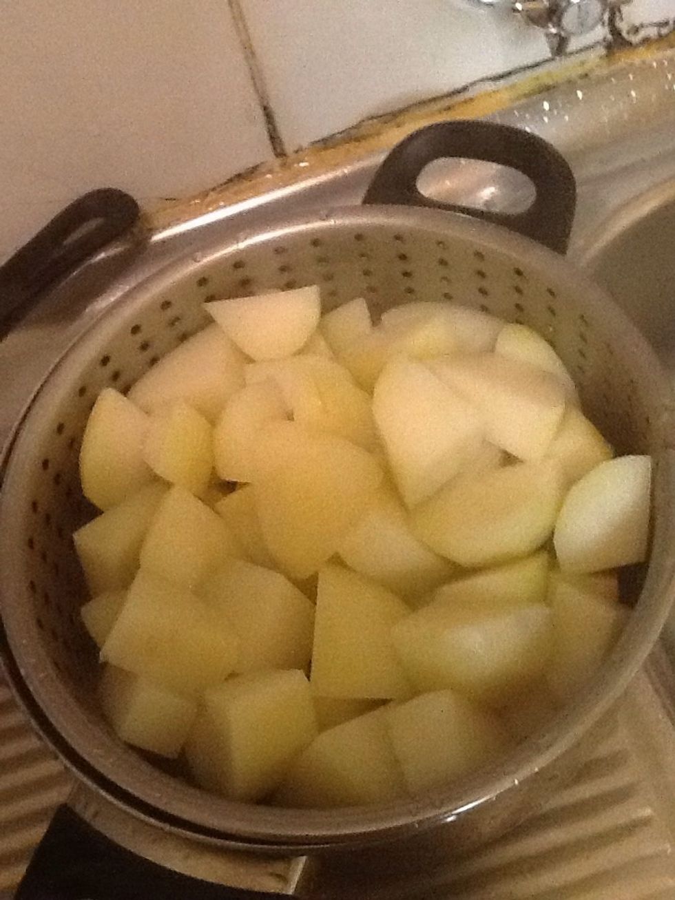 Place all the potatoes into the large pot and add water too 2/3 of the pot