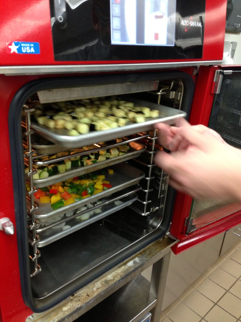 Place all the veggies into the 4.10 combi that has been preheated to 450F (232C).