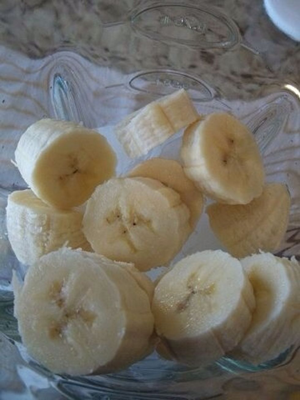 Place all your ingredients in a blender! I place the ice first because it seems like the blender crushes it better. But cut up your banana :D