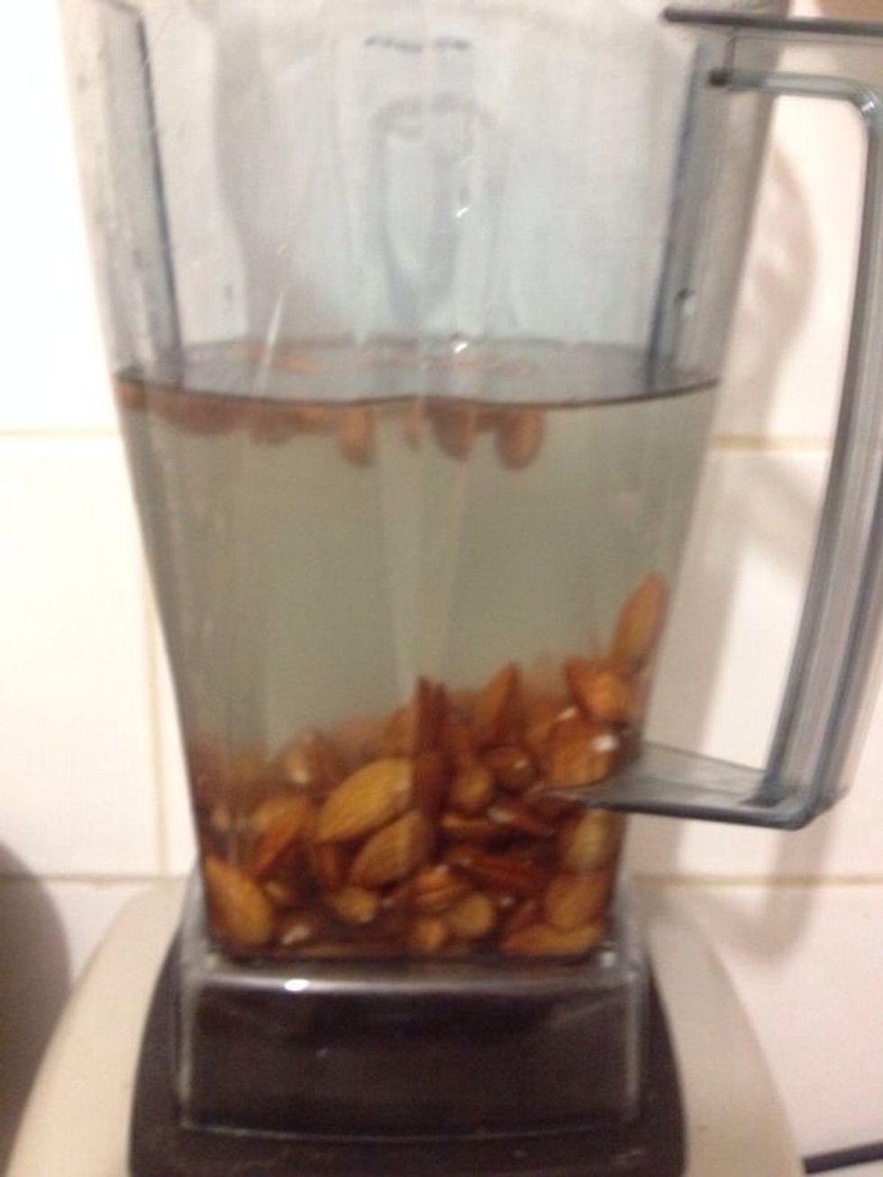 Place almonds in blender with water.