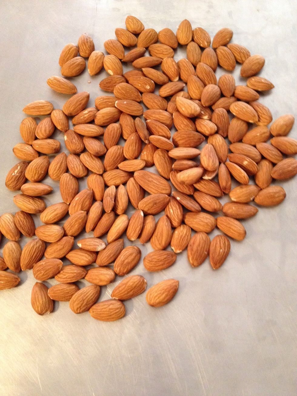 Place almonds on another cookie sheet and bake them along with the pecans for seven minutes.
