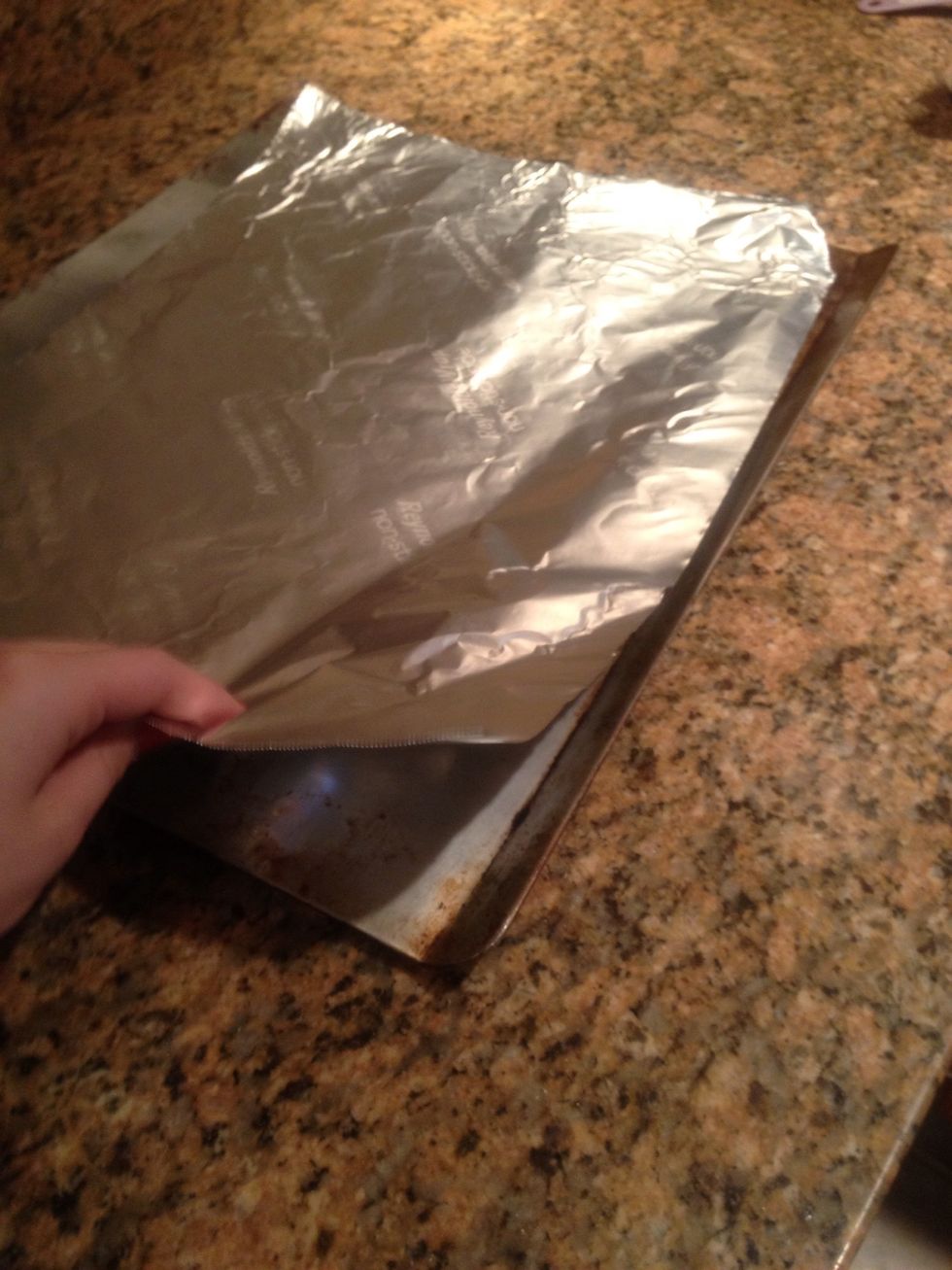 Place aluminum foil on the cookie sheet.