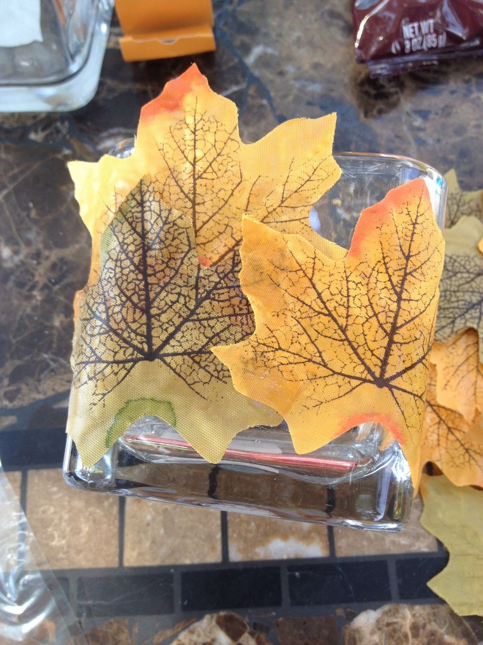 Place and arrange leaves on jar