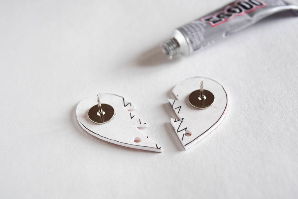 Place and press the pin onto the back of your shrink plastic piece to secure it.
