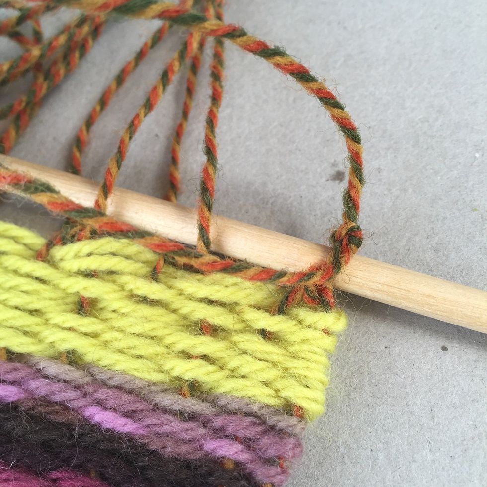 Place another knot above the wooden dowel to hold it in place.