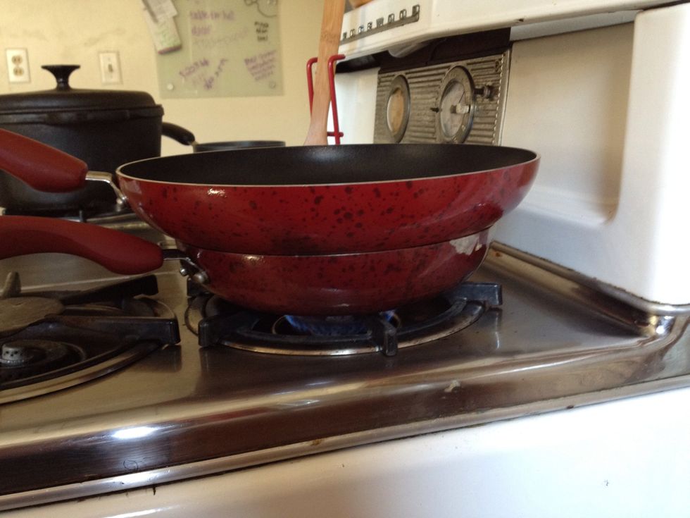 Place another pan or lid over eggs to melt the cheese