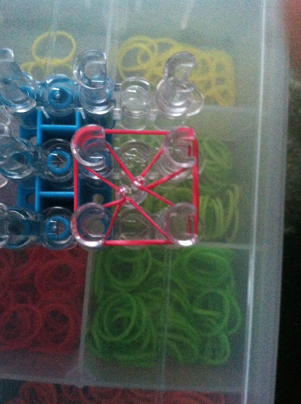 Place another red band on the four pegs