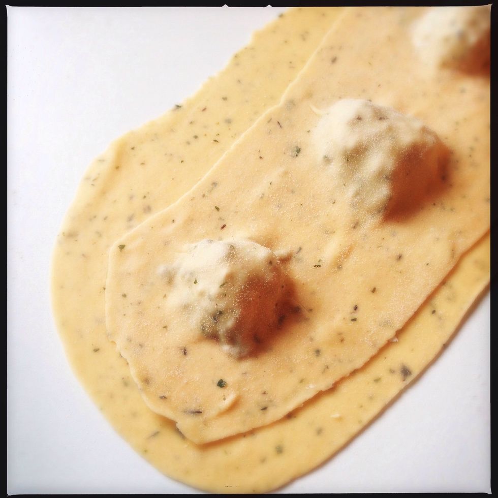 place another sheet of dough on top and close the gaps around the filling.
