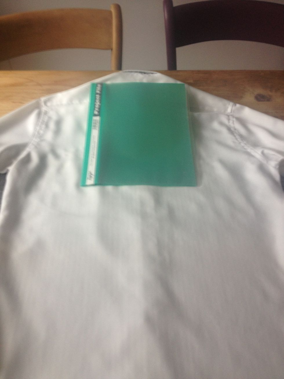 Place anything A4 size at central top of shirt