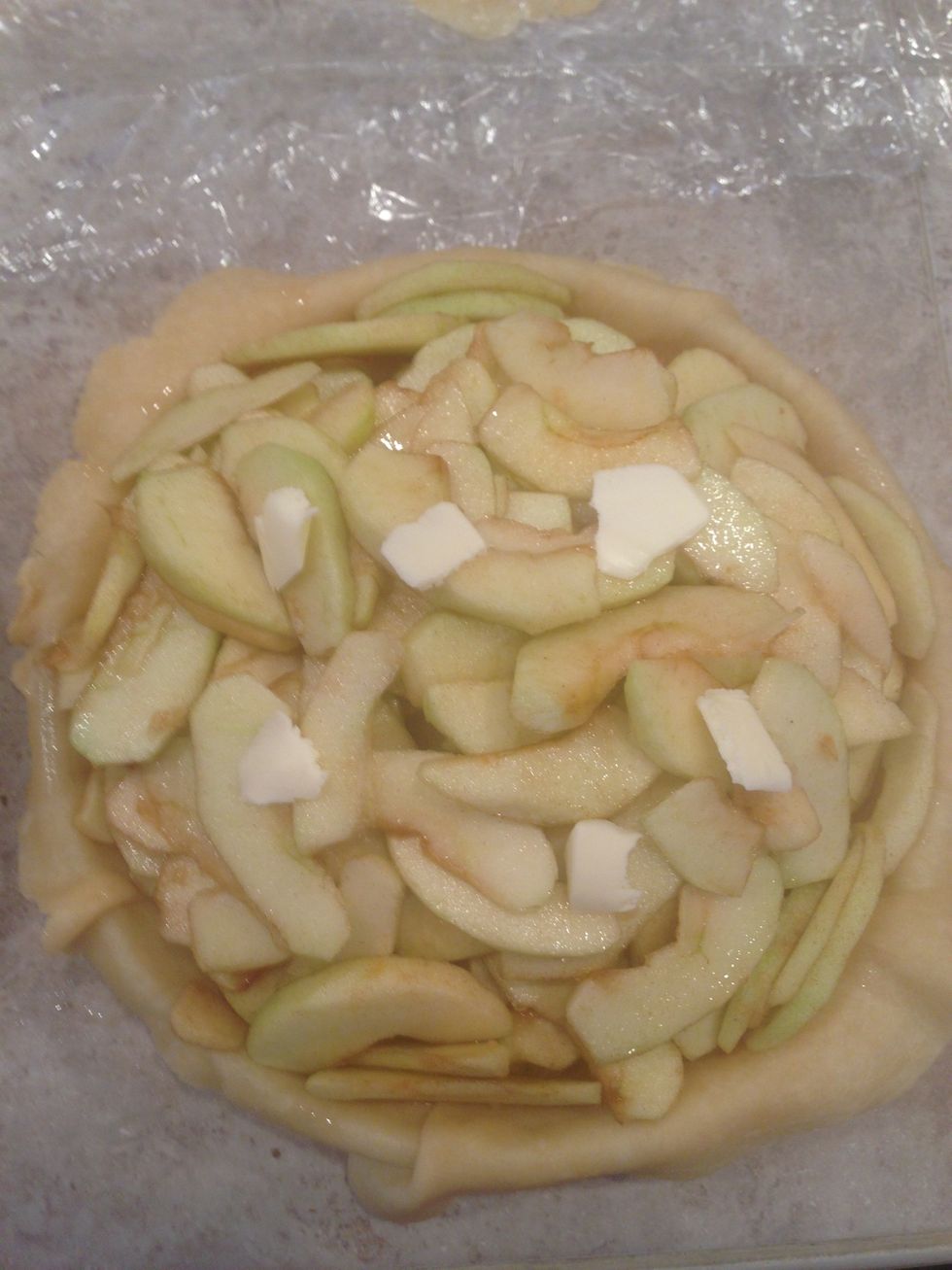 Place apples in lower crust with butter on top of apples.