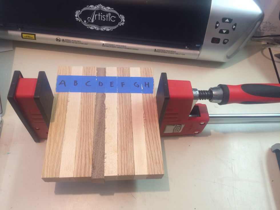 Place assembled cutting board in clamp, as shown.