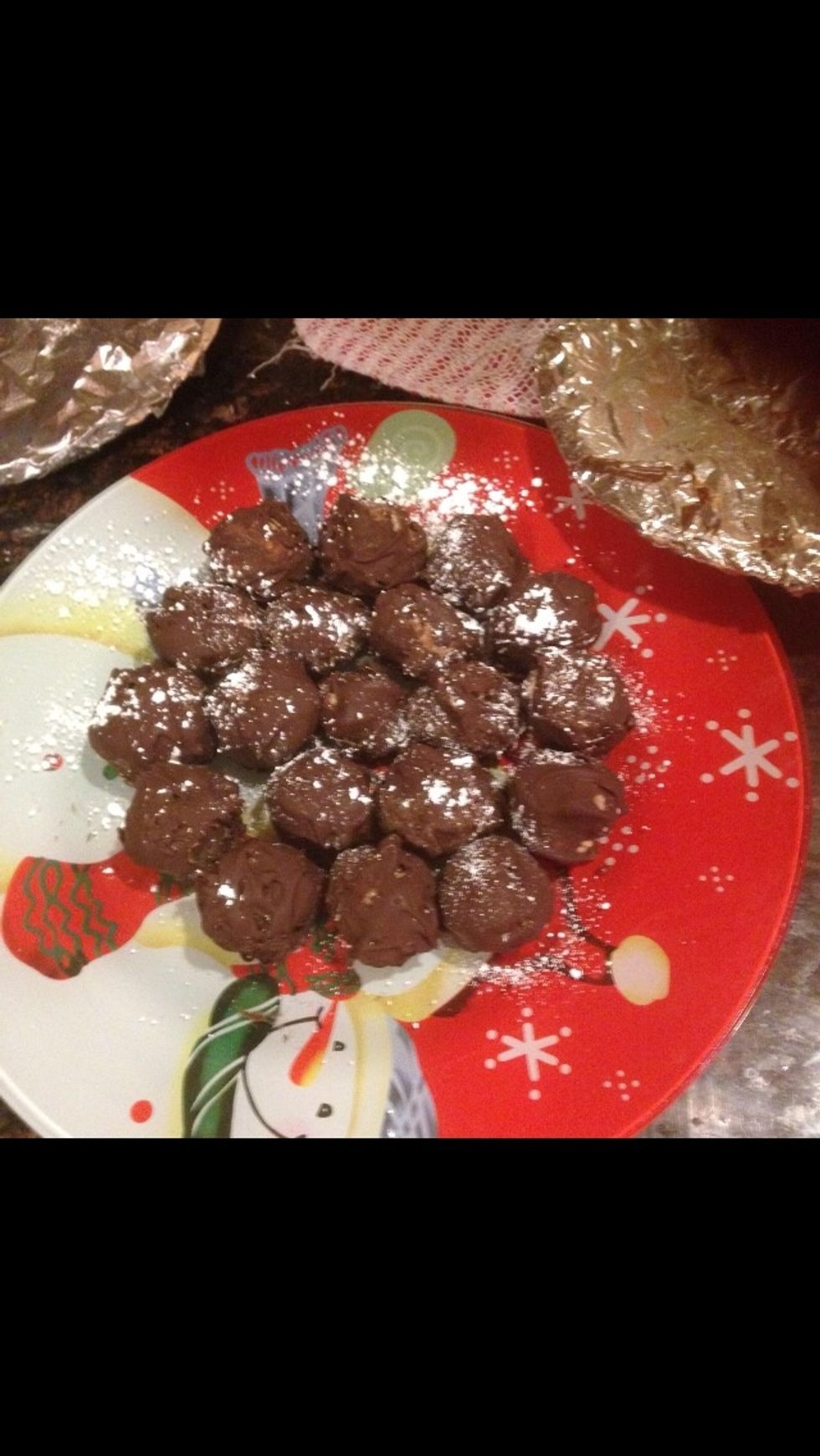Place back in freezer until chocolate hardens. Sprinkle powdered sugar over time for a finished look.