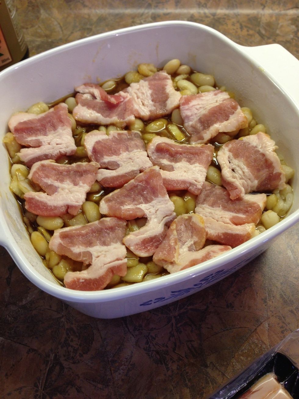 Place bacon pieces on top. You can put more if you like. Sometimes I solidly cover the beans. Bacon adds calories but adds lots of flavor too!