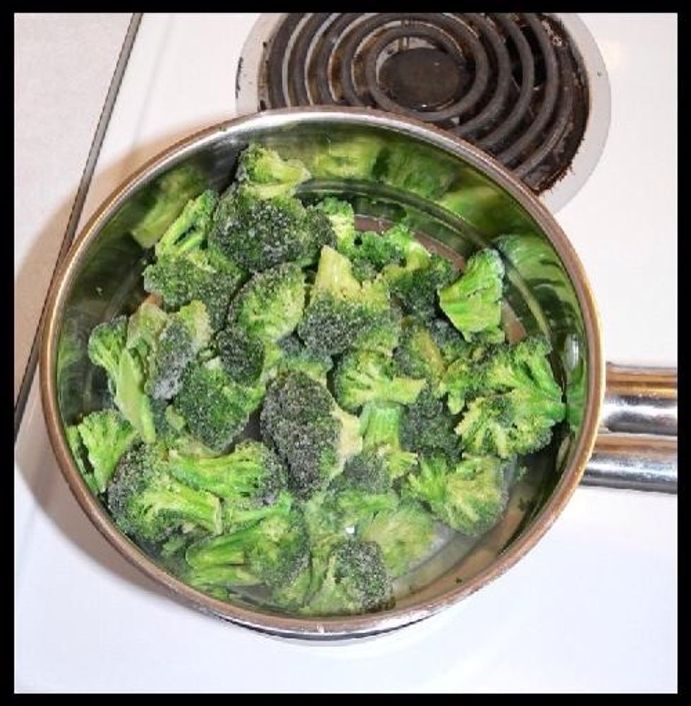 Place bag of frozen broccoli into a double broiler to steam vegetables. Cover, cook on low stirring occasionally, until Broccoli is tender and done.