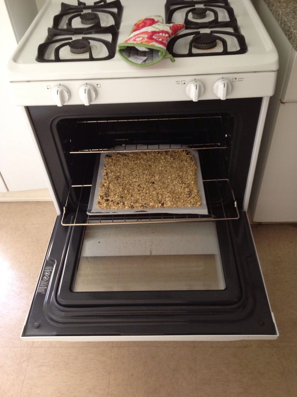 Place baking sheet in the 350-degree oven. Bake for about 20 min. Check granola about halfway through -- if edges look like they're burning, stir the granola, then continue baking