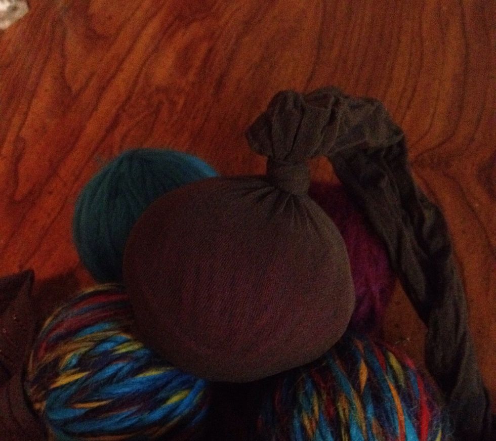 Place ball in pantyhose and tie a knot on top. It is important to tie a knot after placing ball in pantyhose.