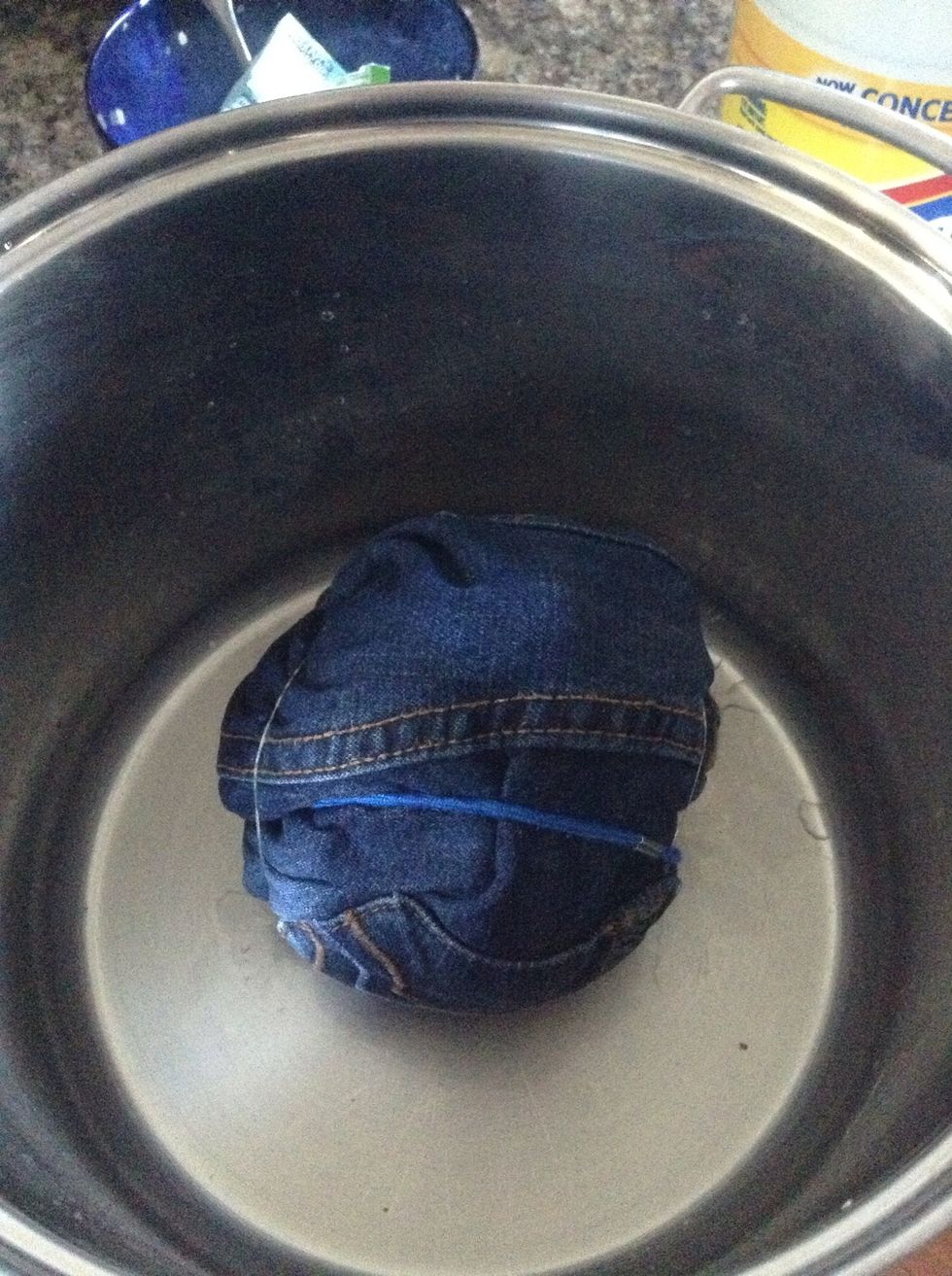 Place balled up shorts into metal bowl