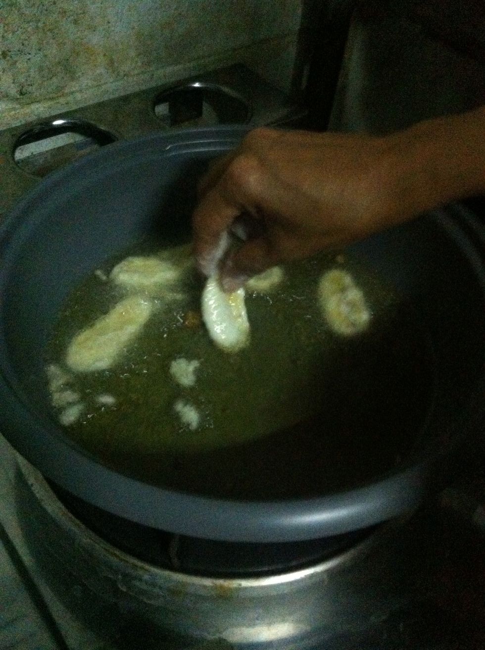 Place banana into hot oil.