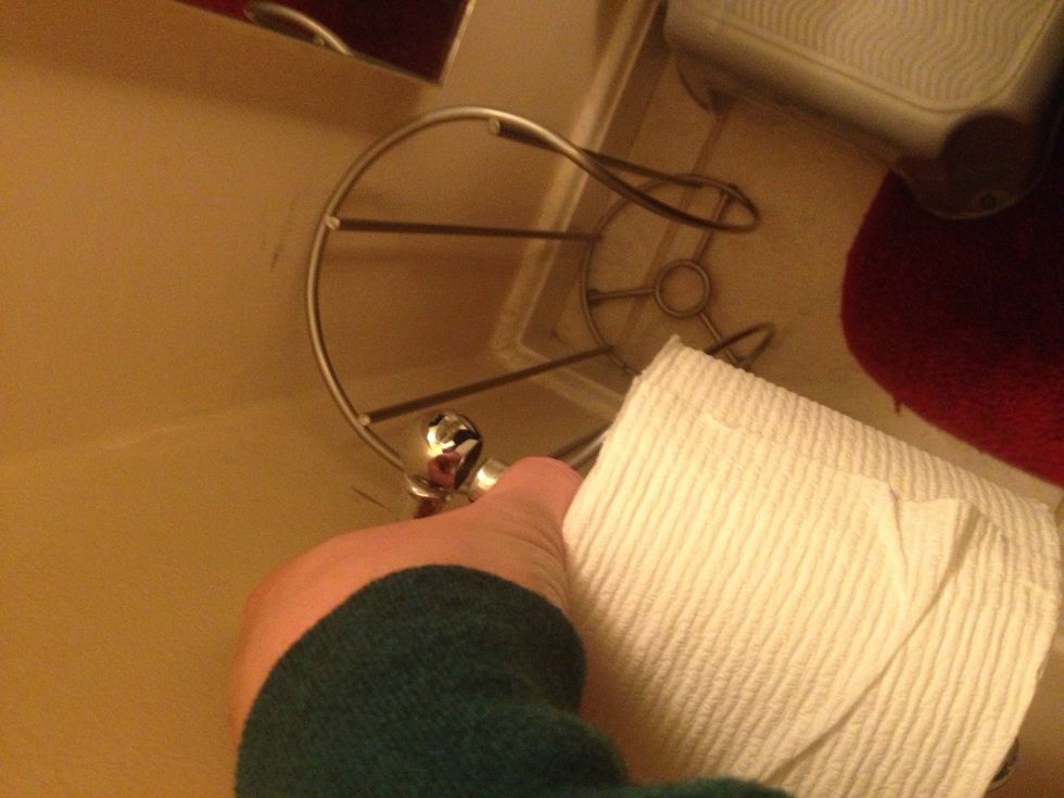 Place bar with toilet paper back onto holder